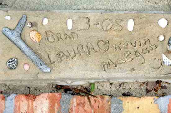 Char's son and daughter-in-law's wedding date is engraved in stone outside the home.
